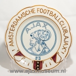 Circular plate featuring 'Amsterdamsche Football Club AJAX' text around the edge, club logo with figure, and number 35 in the center.