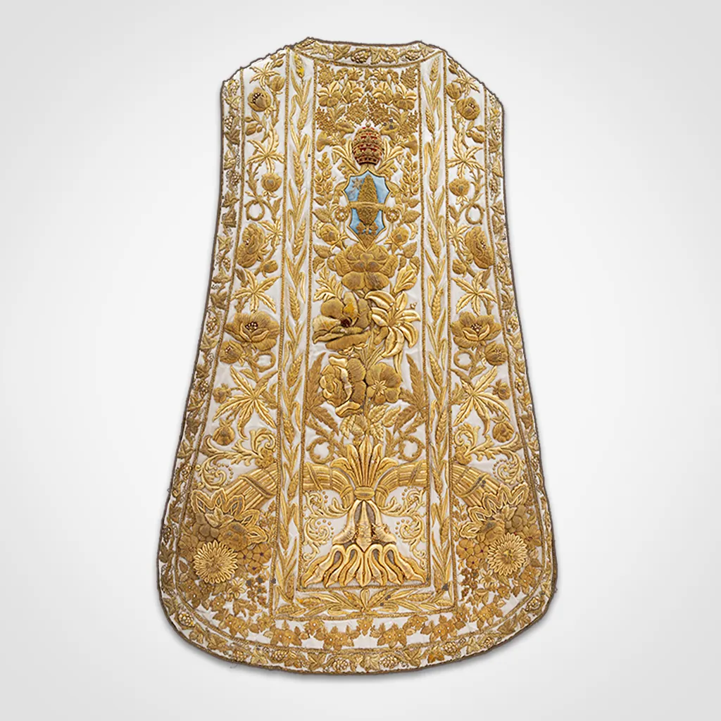 Golden embroidered vestment with floral and religious motifs on a white background