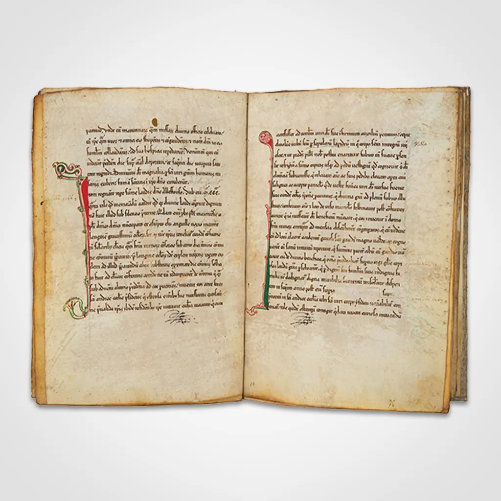 open book with handwritten text and decorative initials