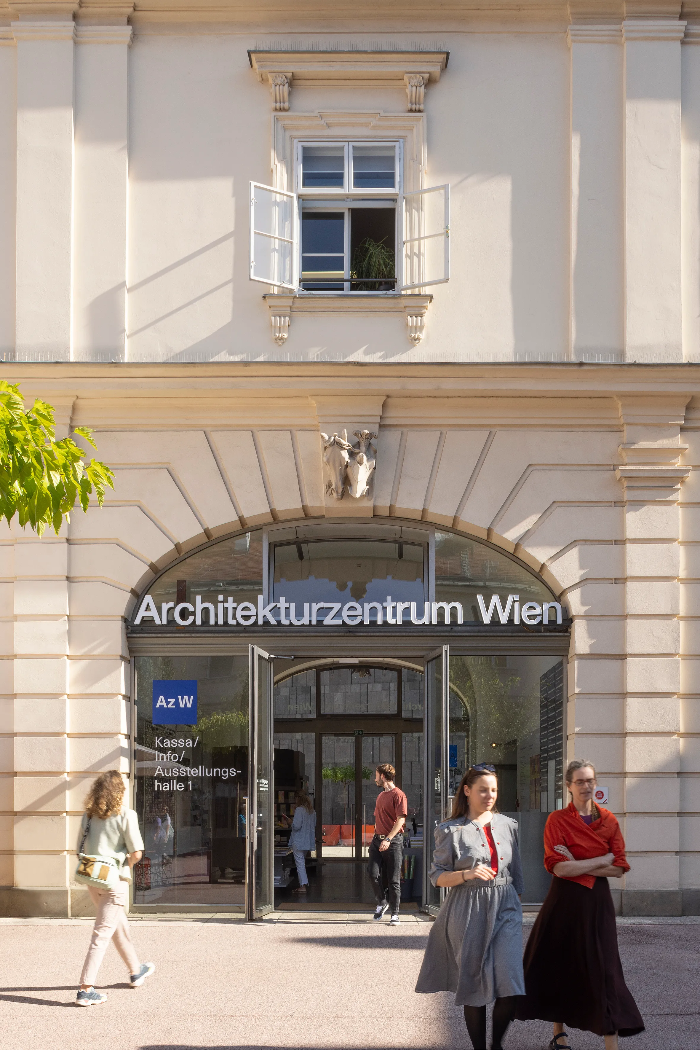 Entrance to Architekturzentrum Wien with people walking by