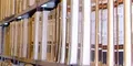 rows of wooden shelves filled with files and documents in a library or archive