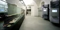 long hallway with display cases and informational panels