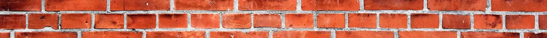 close-up of a red brick wall with white mortar