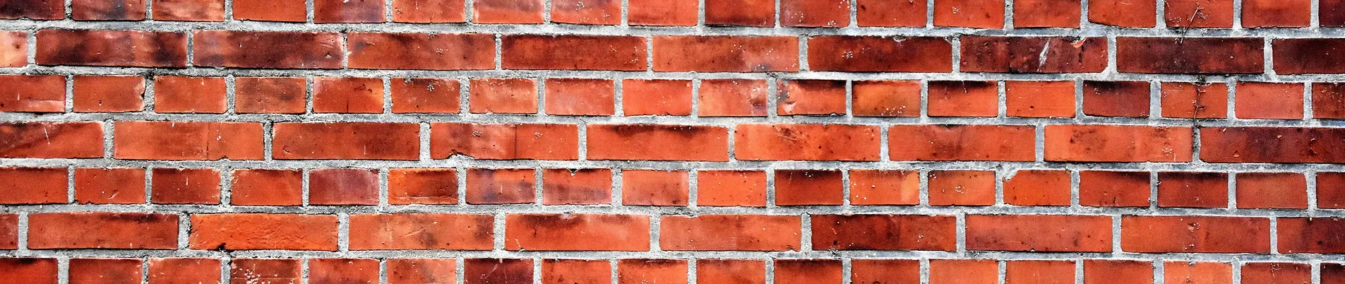 close-up of a red brick wall with visible mortar lines
