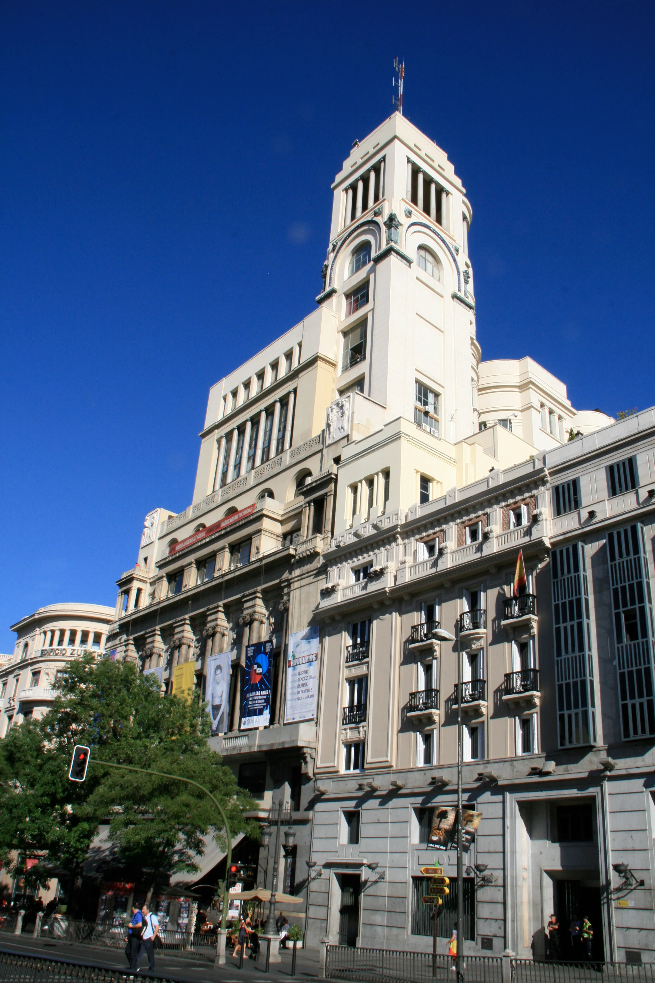 The Círculo de Bellas Artes building with a tall tower and ornate facade under a clear blue sky