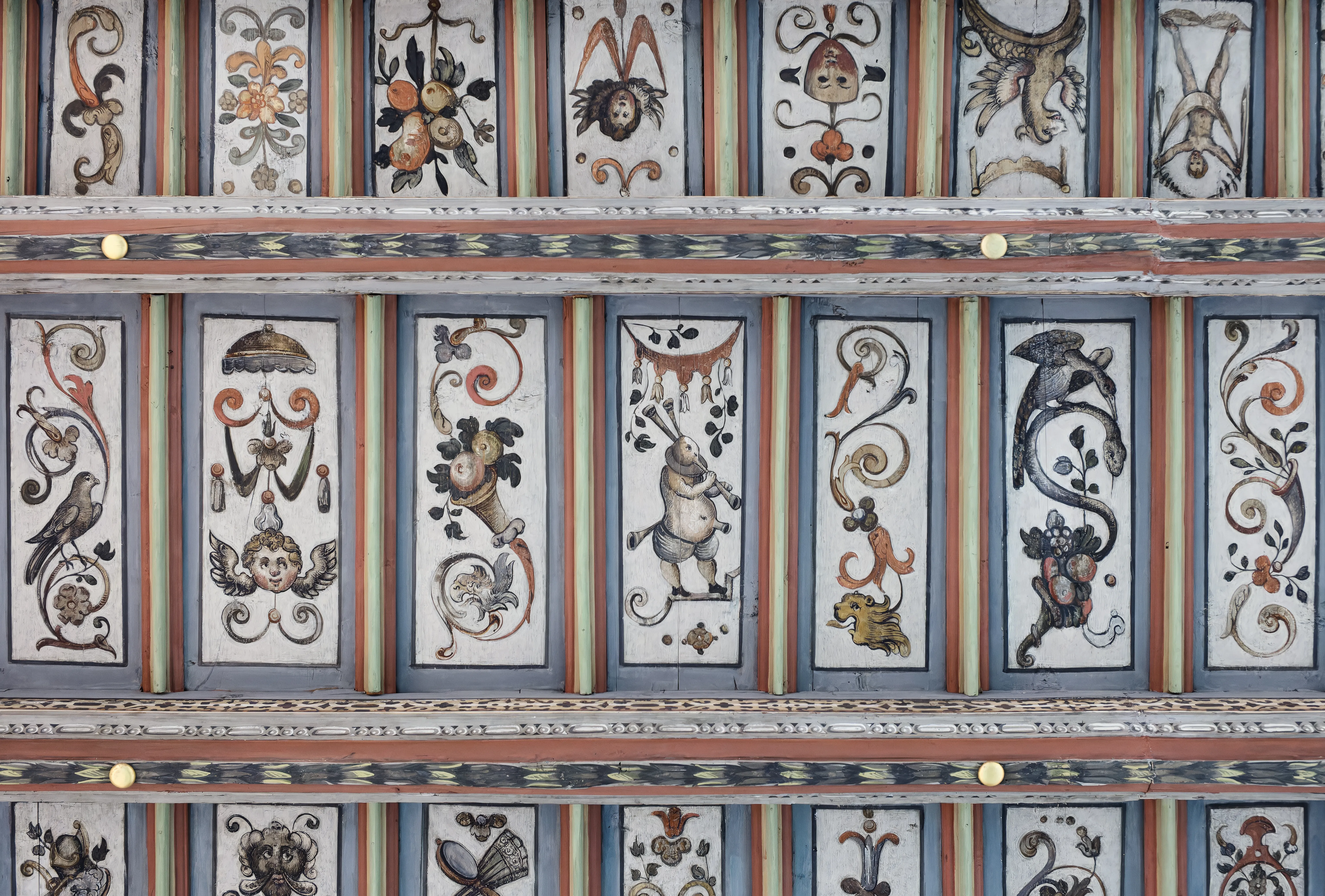 close-up of painted ceiling panels with floral and animal motifs