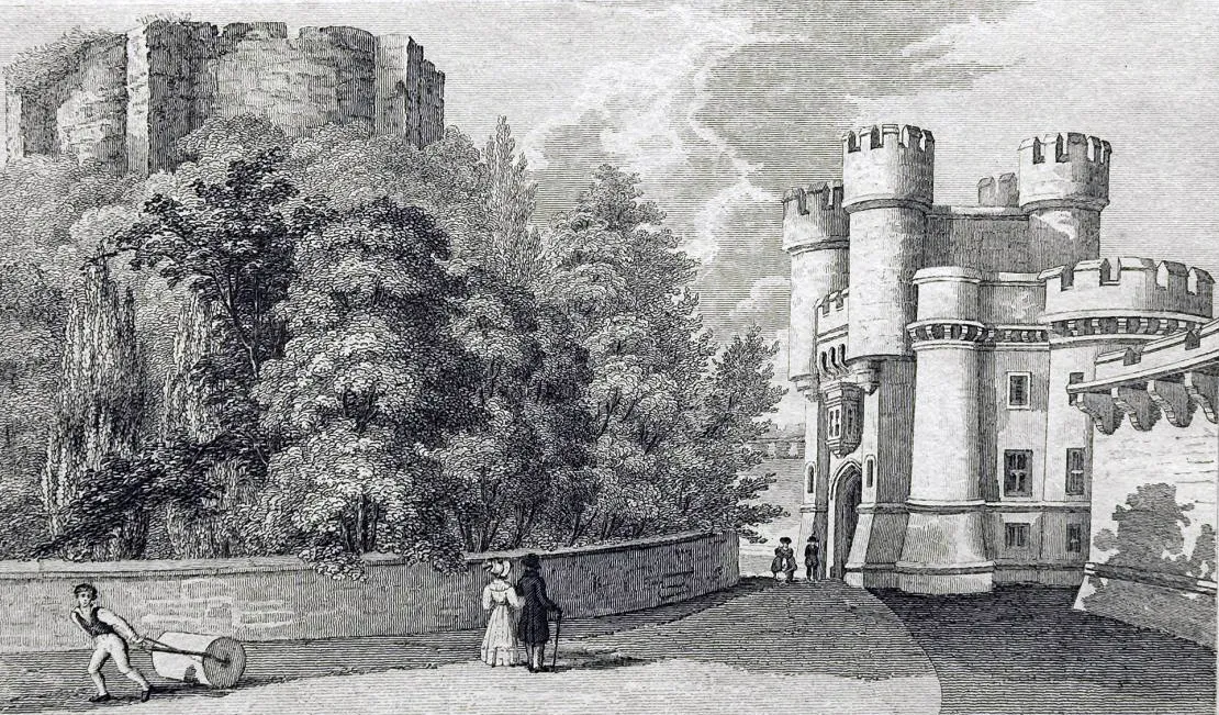 Historyczny rycina przedstawiająca York Castle z ruinami Clifford's Tower na zalesionym wzgórzu po lewej stronie oraz ufortyfikowaną bramę z okrągłymi wieżyczkami po prawej stronie, z małymi postaciami na pierwszym planie, w tym mężczyzną pchającym taczkę.