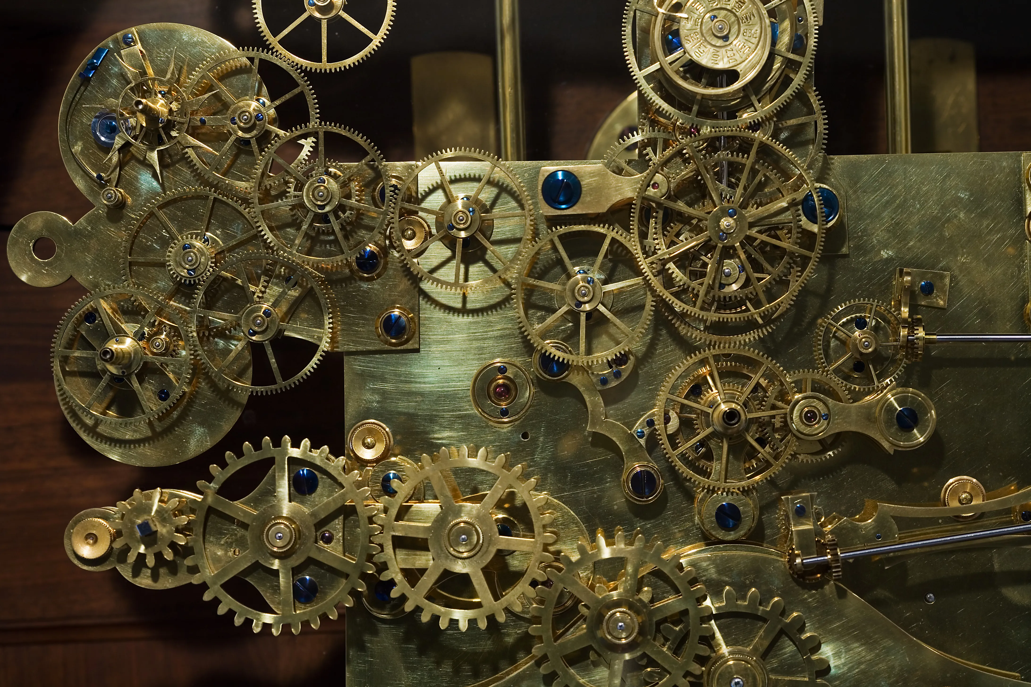 close-up of brass gears and mechanical components of a clock mechanism