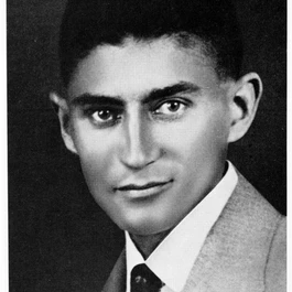 zwart-wit portret van een man in een pak en das