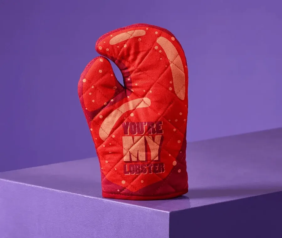 red oven mitt with 'you're my lobster' text on a purple background