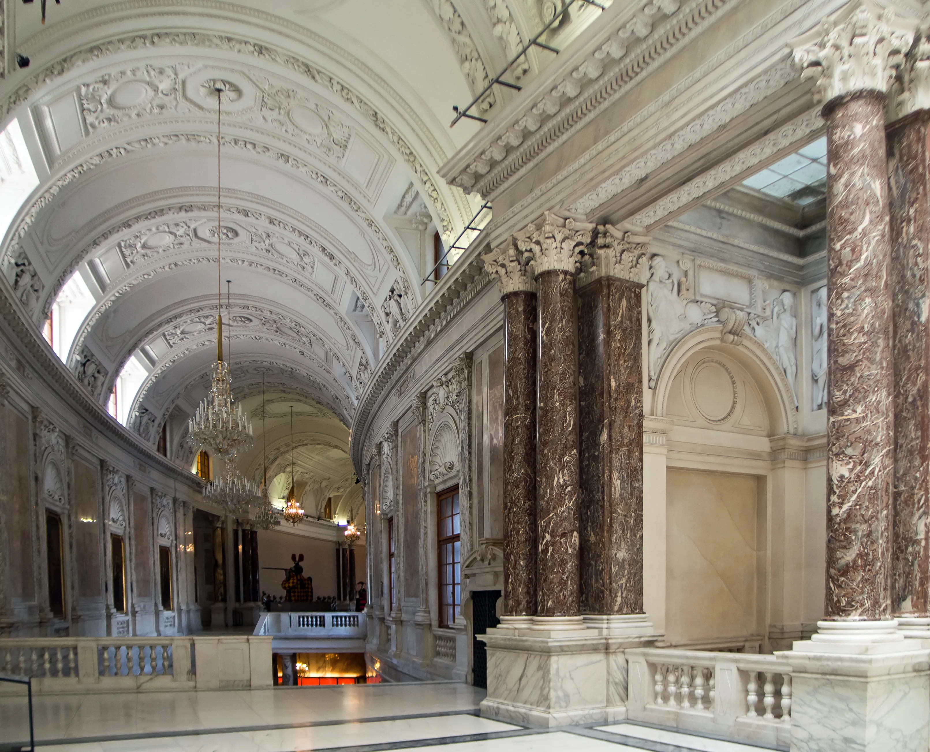 ornate hallway with marble columns and arched ceilings in the House of Austrian History