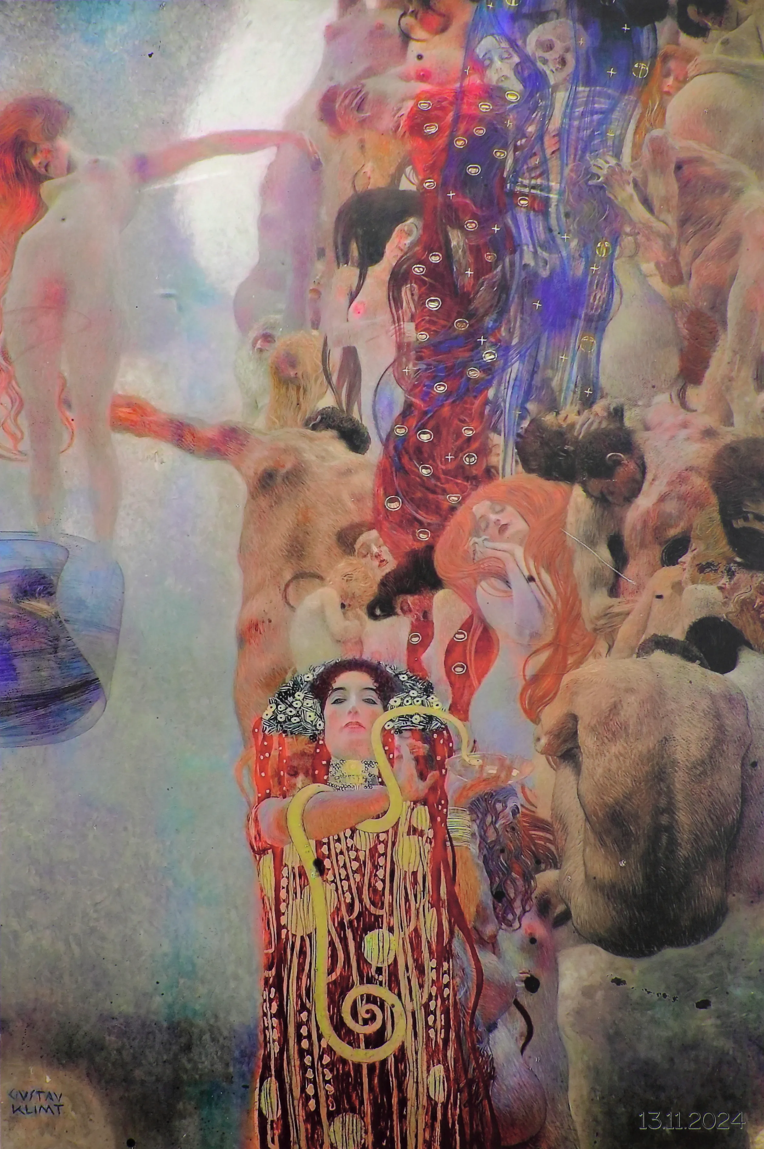a colorful painting with a central female figure in red and gold surrounded by multiple human figures