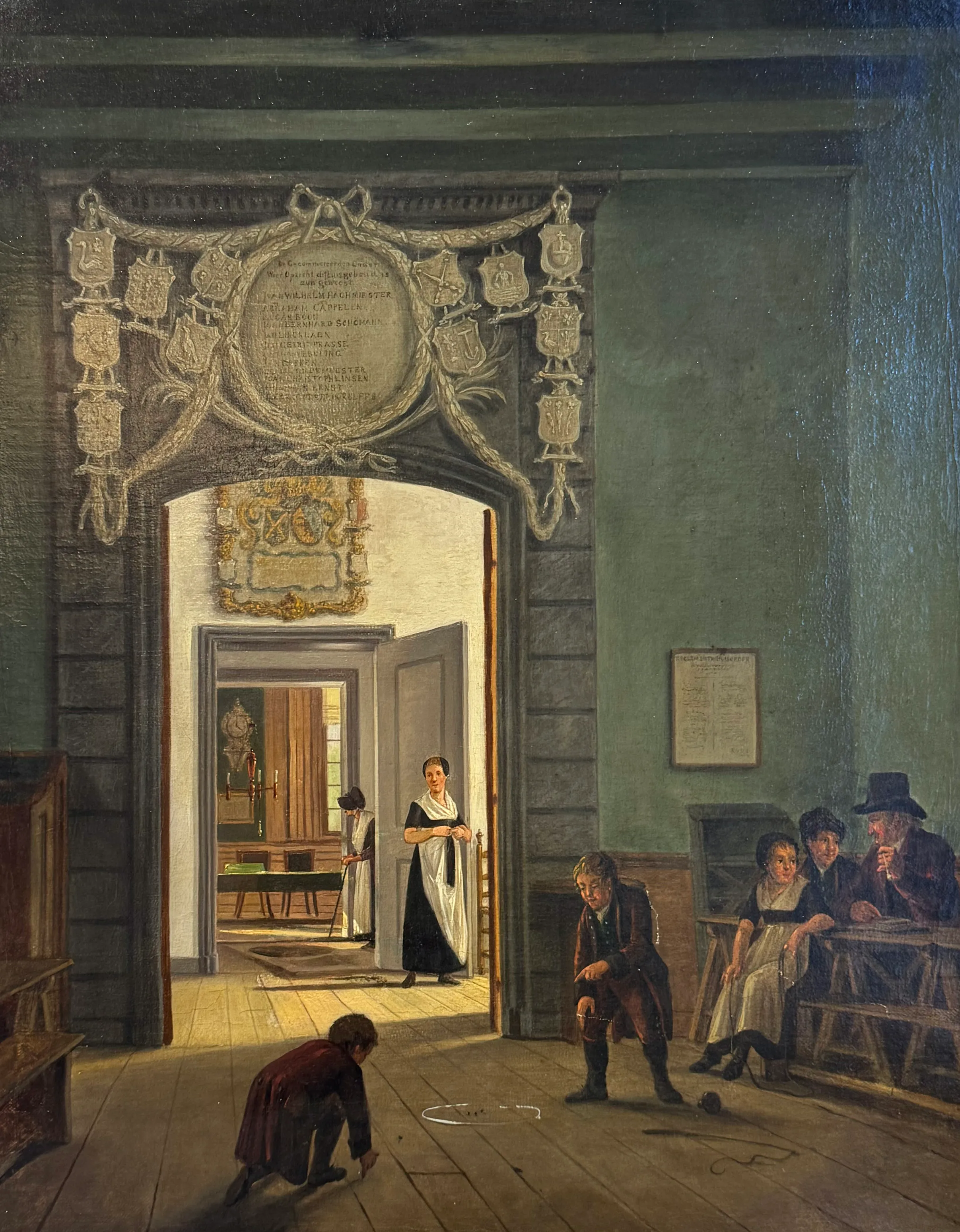Historical painting of a room with people in 18th-century attire, showing a woman in a white apron, a man kneeling, and others seated, with a decorative archway and a plaque above the doorway.