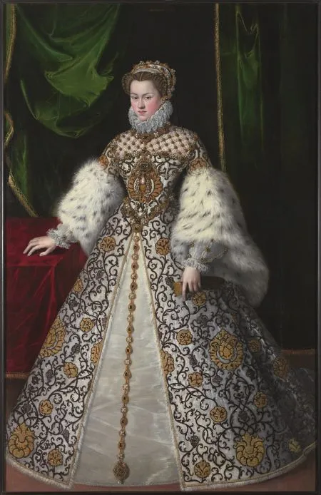 A woman in a richly embroidered Renaissance gown with fur trim and a jeweled necklace, standing before green and red drapery