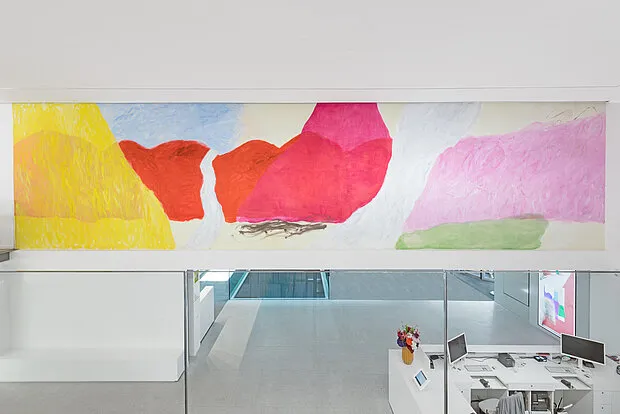 Abstract artwork with colorful geometric shapes displayed in a museum gallery