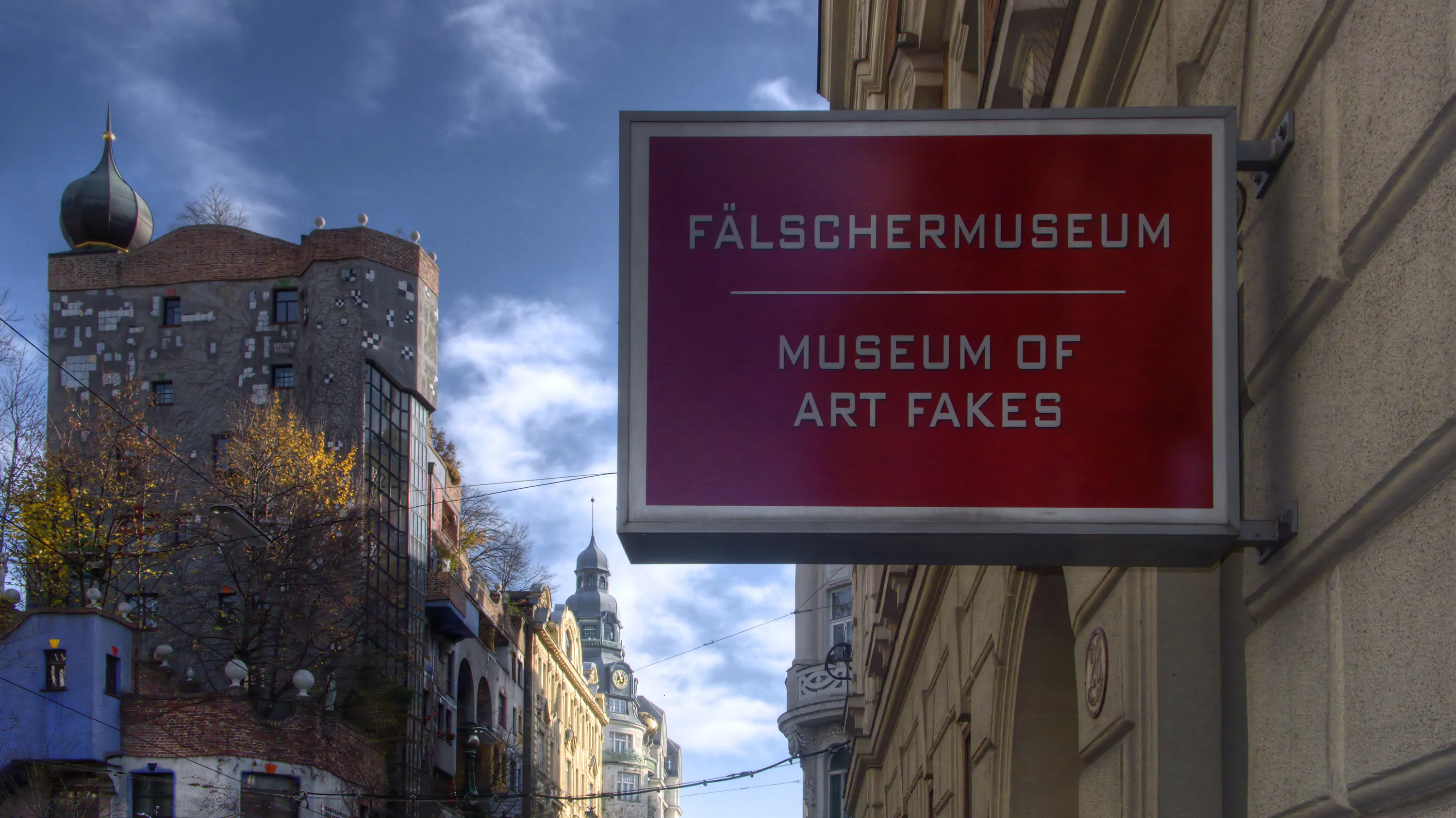 Red sign reading FÄLSCHERMUSEUM MUSEUM OF ART FAKES on a building exterior