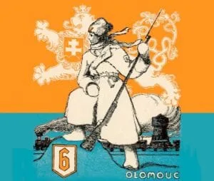 Logo przedstawiające żołnierza w historycznym mundurze trzymającego karabin, z białym lwem heraldycznym i liczbą 6 na pomarańczowo-niebieskim tle.