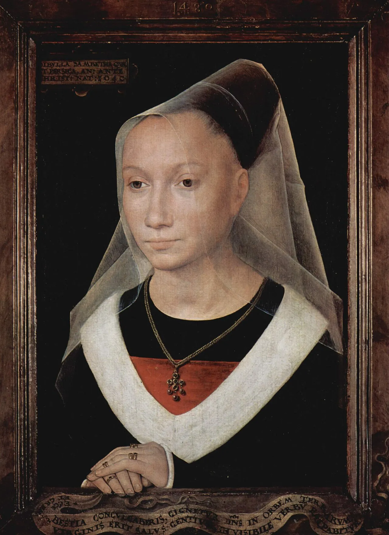 Renaissance portrait painting of a woman wearing a black dress with white fur trim, sheer veil, and gold pendant necklace, displayed in an ornate wooden frame with Latin inscription scroll