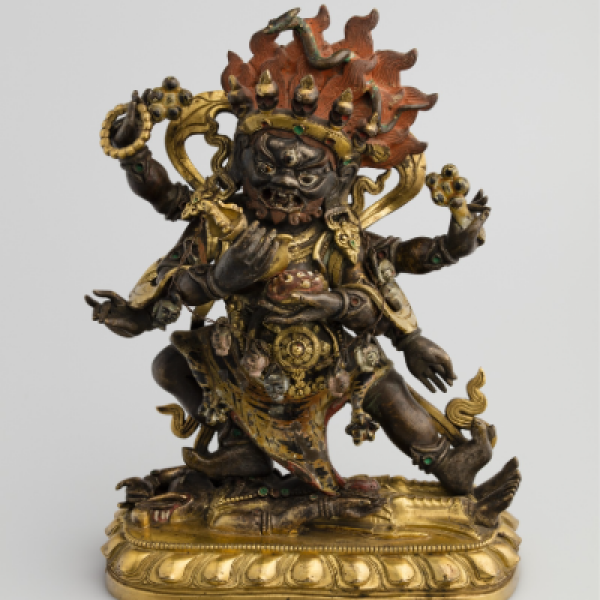 bronzen en gouden standbeeld van een veelarmige godheid met een vlamachtige kroon