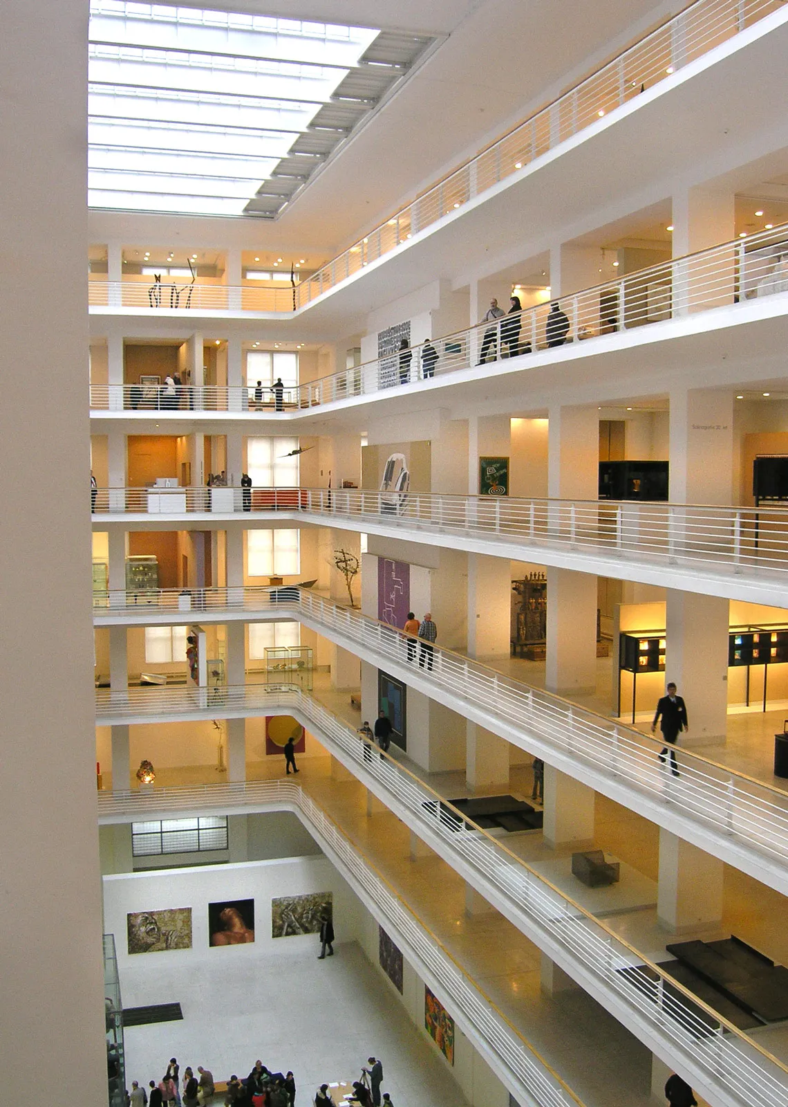 multi-level atrium with white railings and a skylight in the Wallenstein Riding School