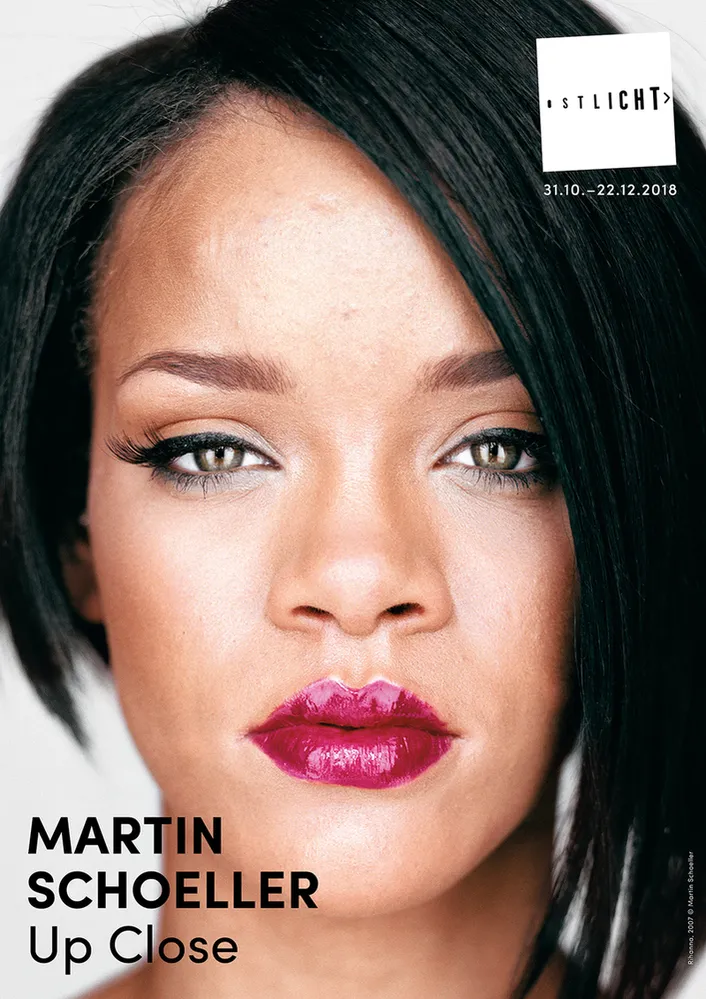 close-up portrait of a woman with dark hair and red lipstick, with text identifying the exhibition 'Up Close' by Martin Schoeller at OstLicht Gallery