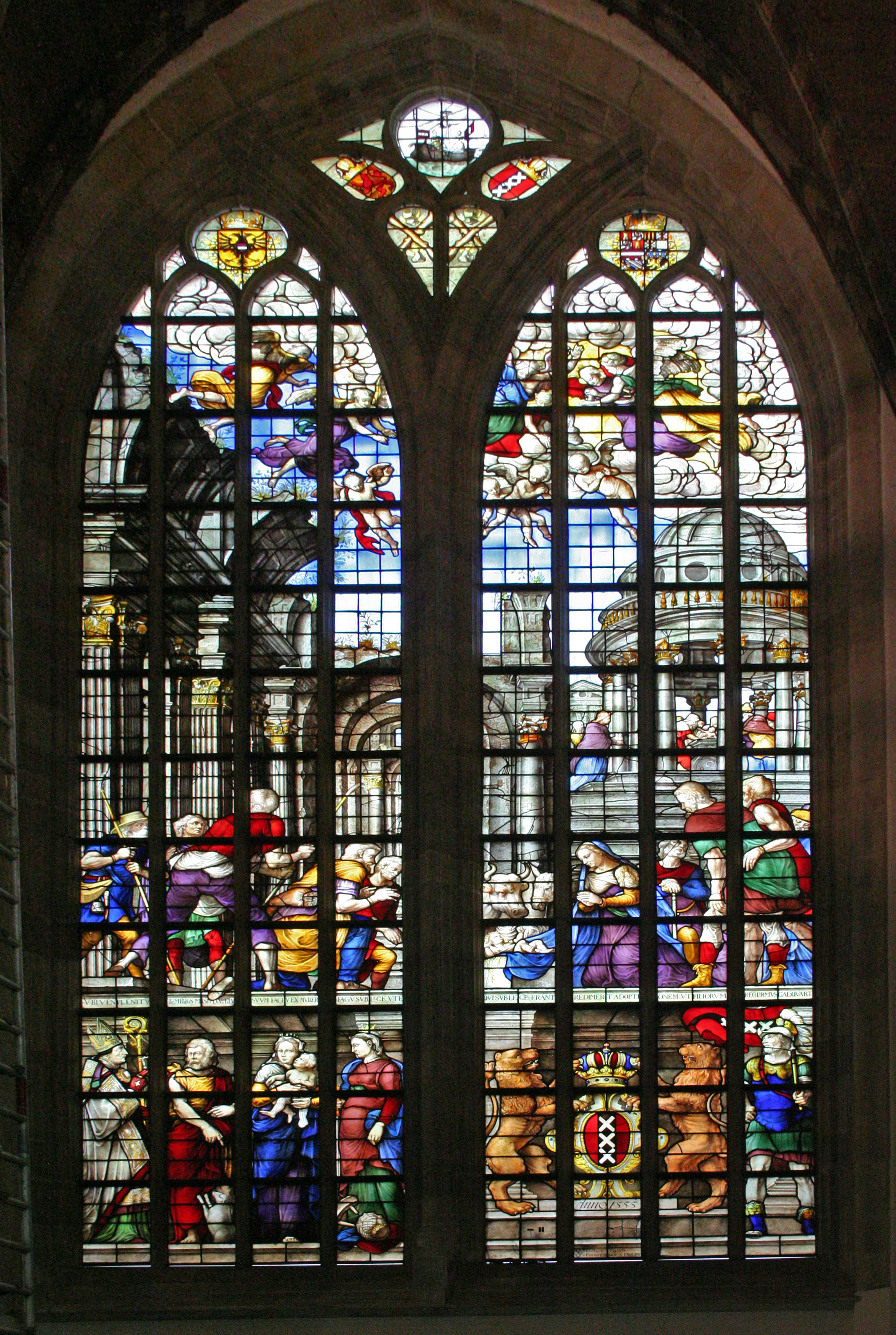 Vibrant stained glass window with biblical figures and scenes inside Oude Kerk, showcasing medieval craftsmanship.