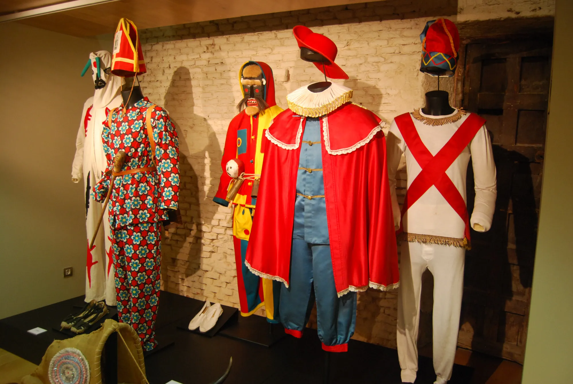 Mannequins wearing traditional Spanish costumes with colorful embroidery and ceremonial hats