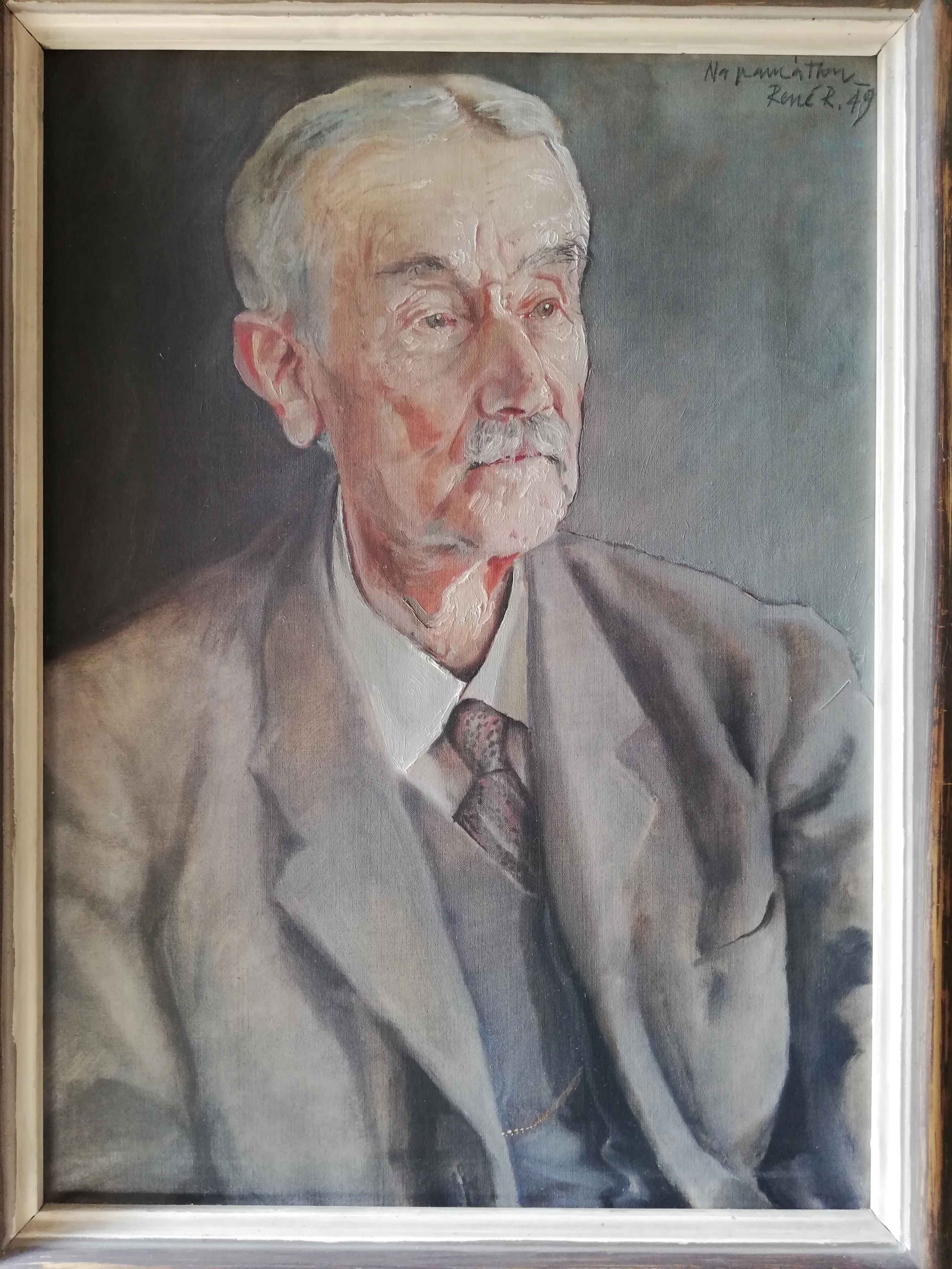 framed portrait painting of an elderly man in a suit