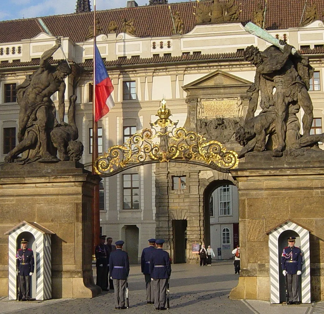 Hradčany Gate at Prague Castle with guards in blue uniforms standing at attention
