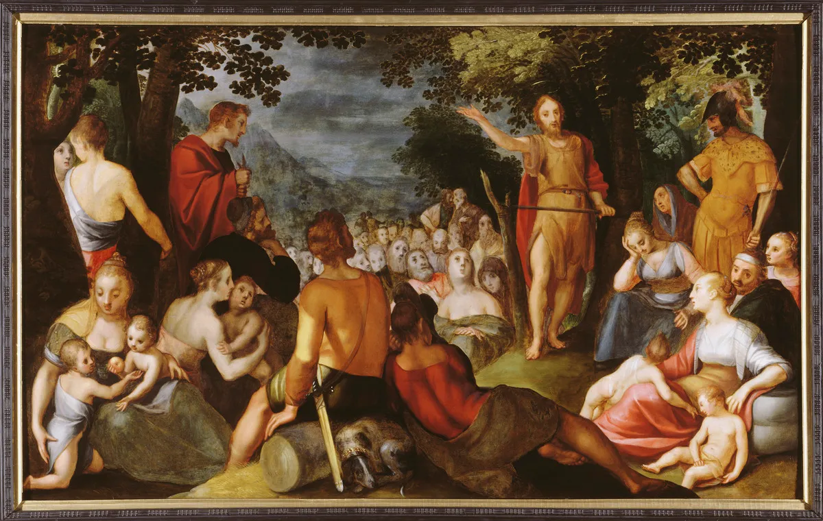 Ingelijfd olieverfschilderij met een menigte mensen in een bosrijk landschap die luisteren naar een staande prediker.