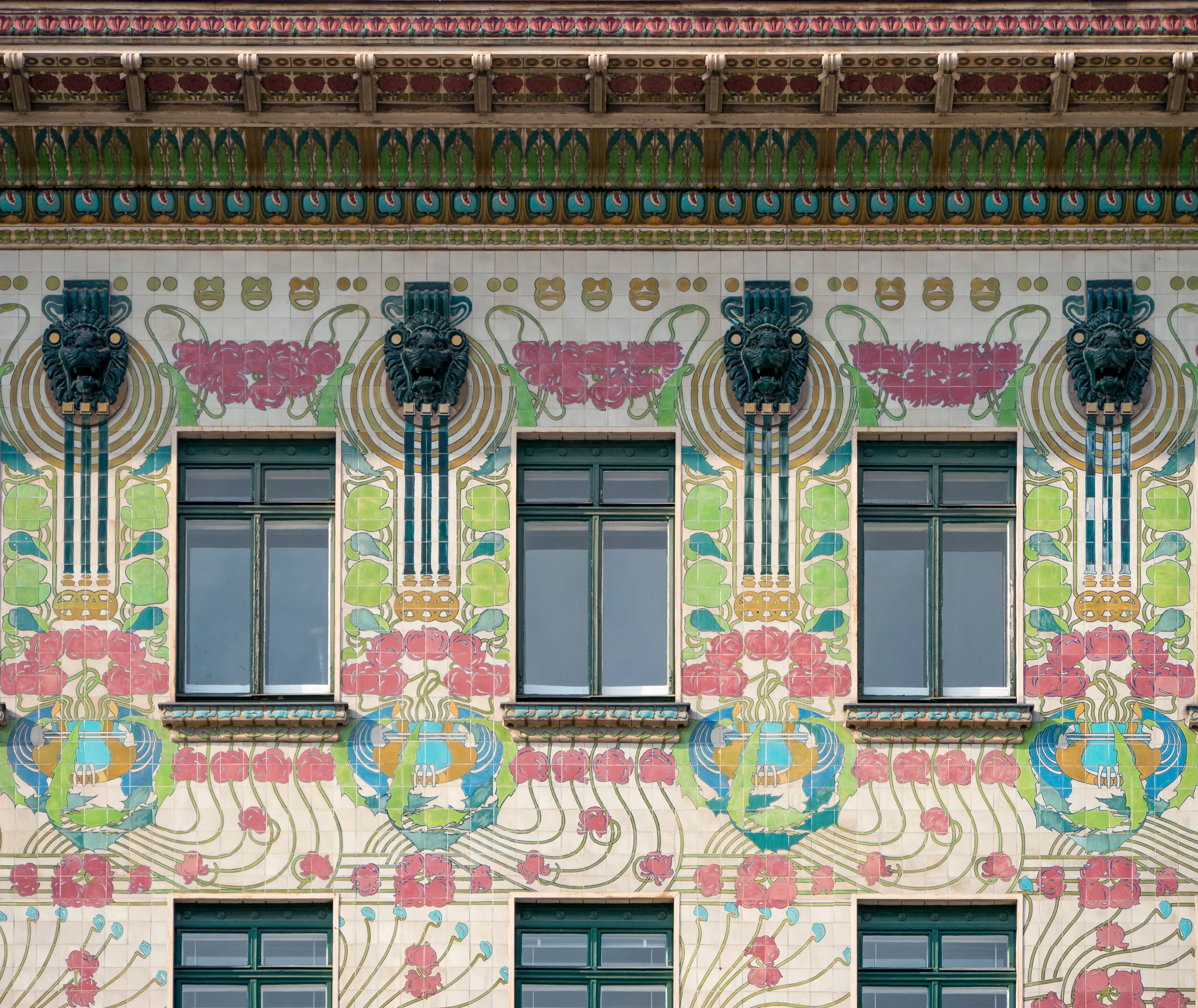 close-up of decorative facade with floral patterns and ornate details