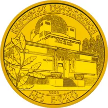 gold coin with engraved image of the Secession building and text around the edge