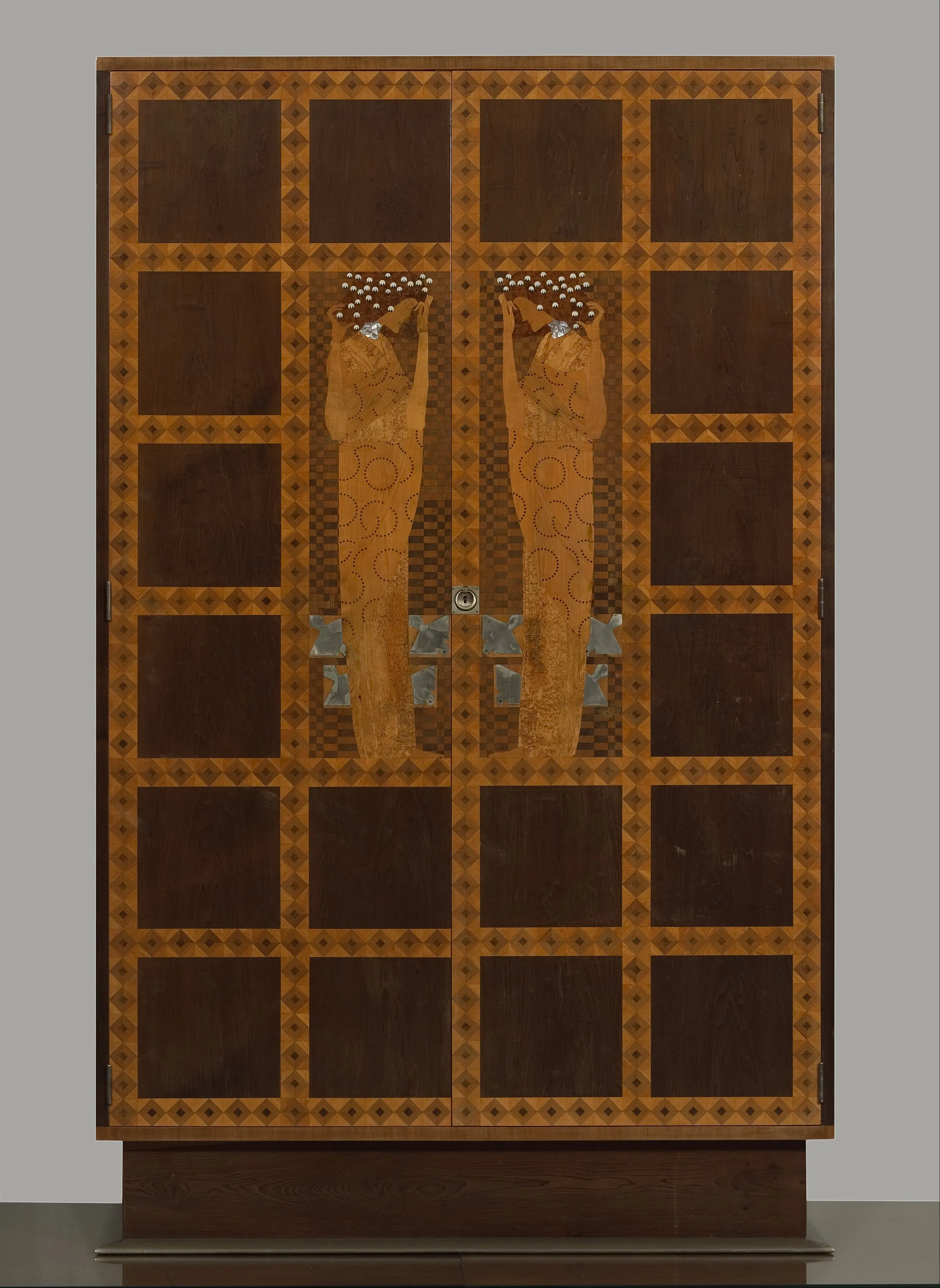 Inlaid armoire with two figures and geometric patterns