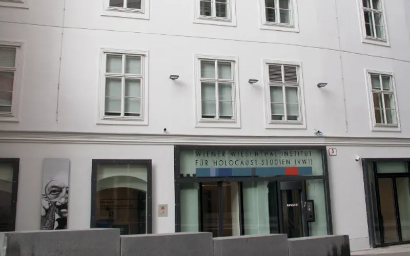 white building with windows and a sign reading Vienna Wiesenthal Institute for Holocaust Studies