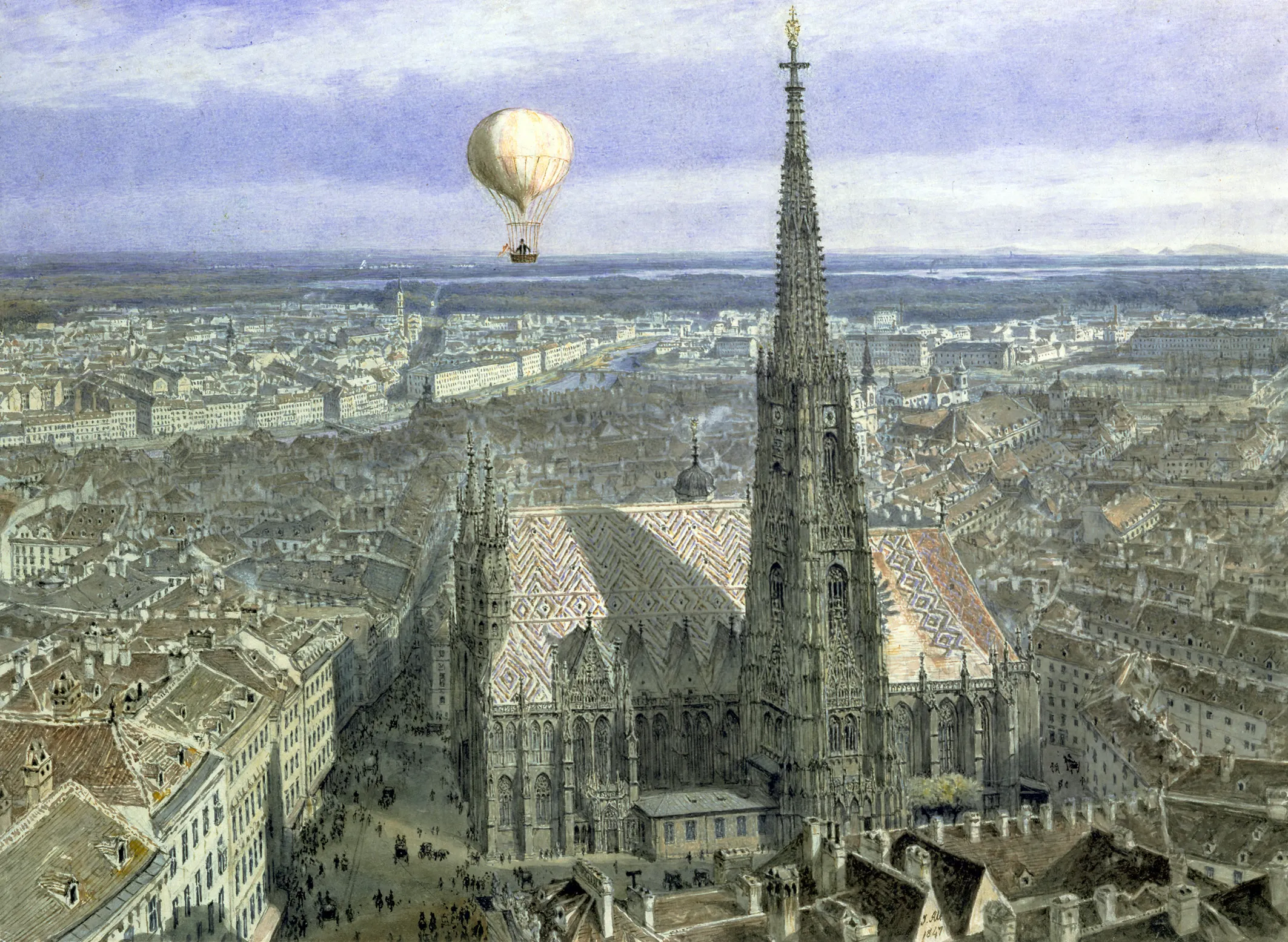 Aerial view of St. Stephen's Cathedral with a hot air balloon in the sky