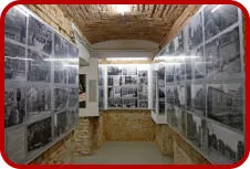 Interior hallway of the Third Man Museum with walls covered in black and white photographs