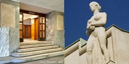 Entrada con paredes y escalones de mármol, y una estatua de una mujer en la fachada de un edificio