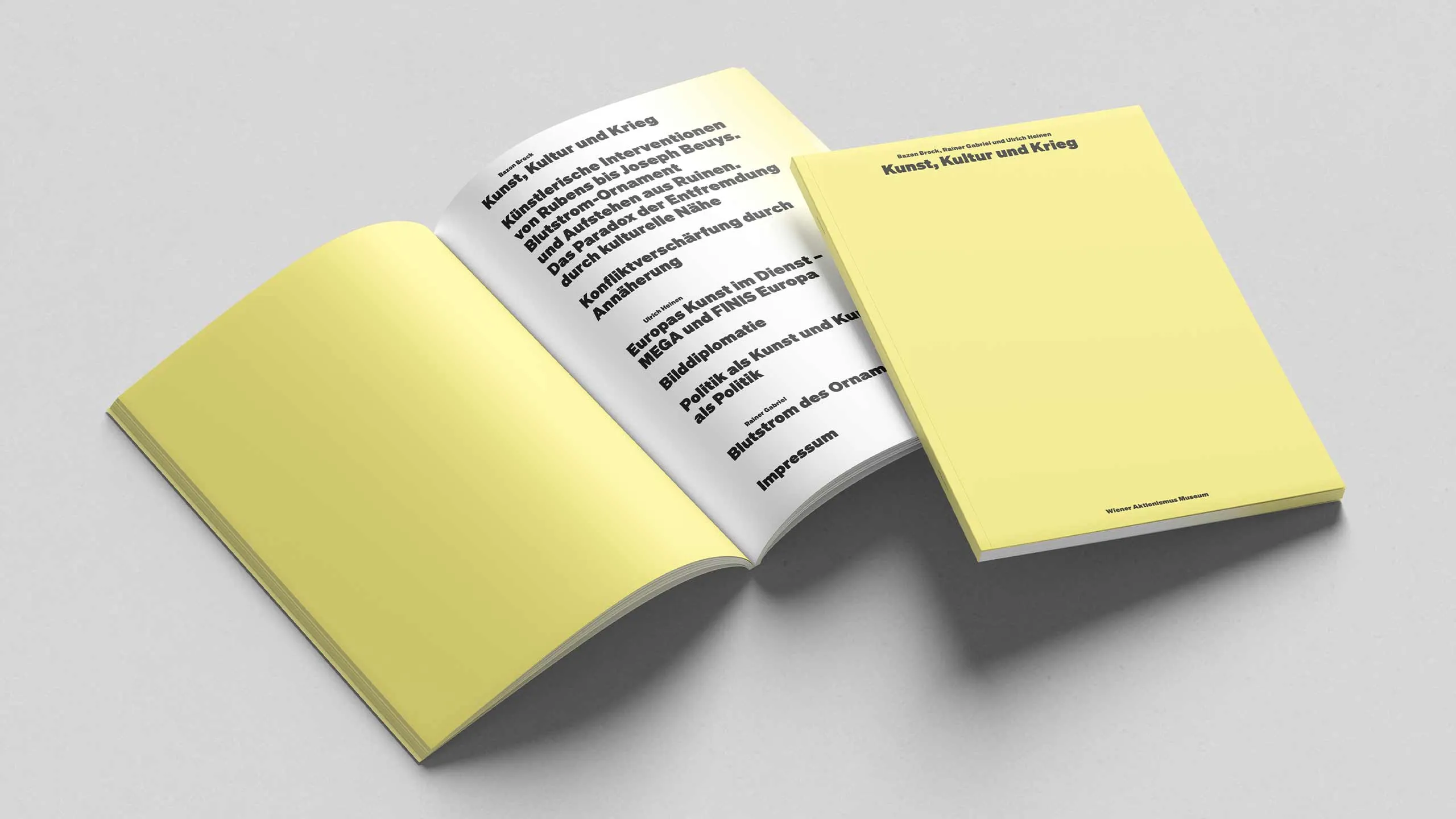 open book with yellow cover and pages showing text