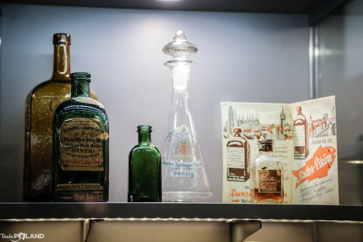 vintage vodka bottles and packaging in a display case