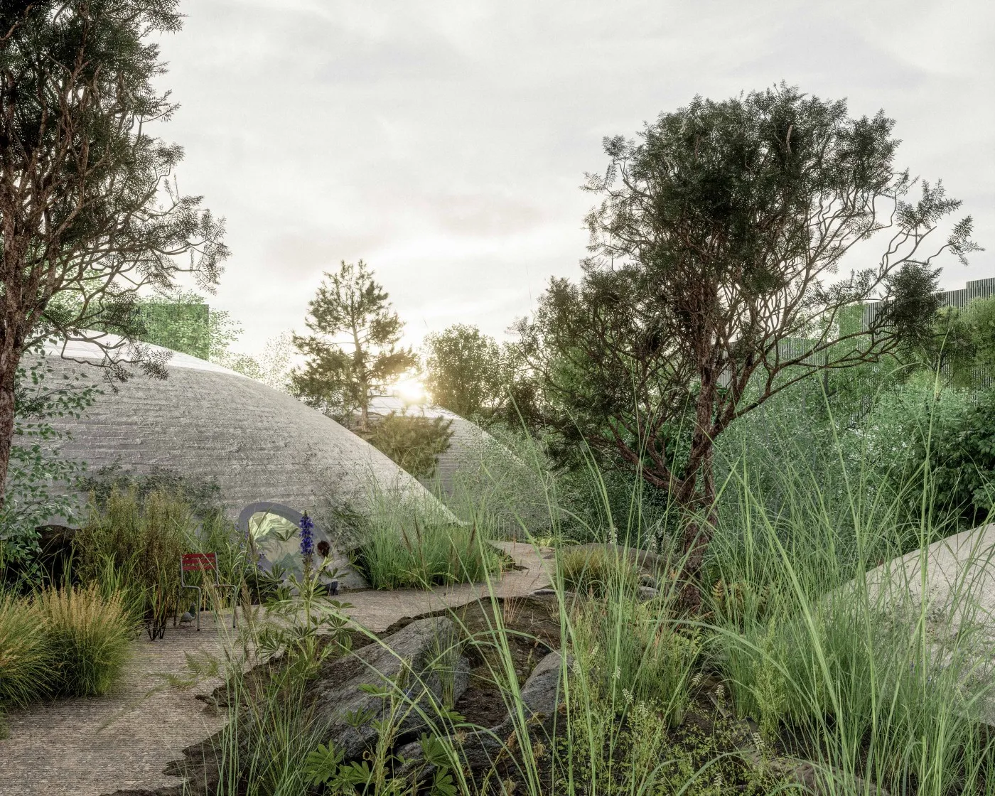 Estructuras de hormigón en forma de cúpula rodeadas de árboles y hierba alta a lo largo de un sendero sinuoso.
